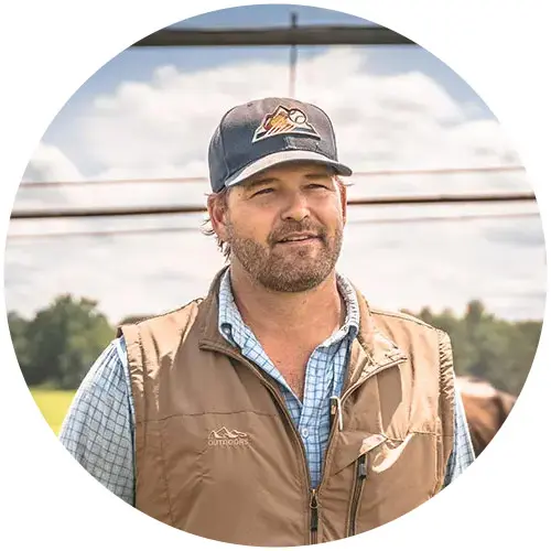 Clay Wehner with dairy cow in the background.